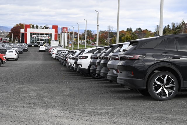 New cars are lined up at dealership on Friday October 11, 2024 in Levis Que. THE CANADIAN PRESS/Jacques Boissinot