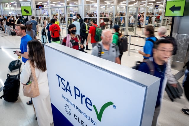 A TSA Pre-check sign is visible as travelers move through Hartsfield-Jackson Atlanta International Airport on June 28, 2024 in Atlanta, Georgia.