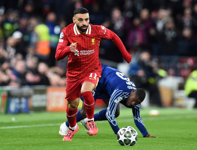 Soccer Football - Champions League - Round of 16 - Second Leg - Liverpool v Paris St Germain - Anfield, Liverpool, Britain - March 11, 2025 Liverpool's Mohamed Salah in action with Paris St Germain's Nuno Mendes REUTERS/Peter Powell/File Photo
