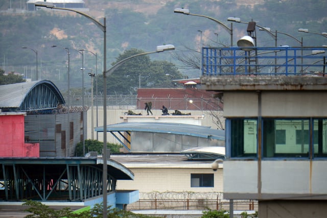 Snipers position themselves on top of a roof inside the Litoral Penitentiary on January 7, 2024, in Guayaquil, Ecuador.
