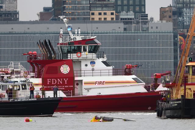 An FDNY boat and an Army Corps of Engineers boat floats next to the site of a crashed helicopter on the Hudson River on April 10, 2025 in Jersey City, New Jersey.