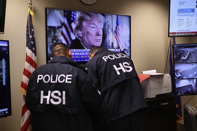 Homeland Security Investigations (HSI) ICE agents work in a control center in Central Islip, New York.