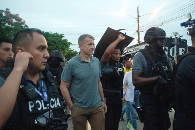 Blackwater Founder Erik Prince walks with police members during an operation in Guayaquil on April 5.