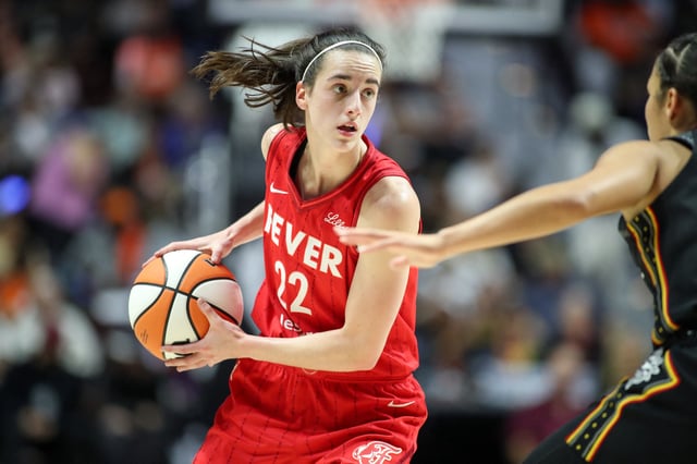 Sep 25, 2024; Uncasville, Connecticut, USA; Indiana Fever guard Caitlin Clark (22) possesses the ball during the first half against the Connecticut Sun during game two of the first round of the 2024 WNBA Playoffs at Mohegan Sun Arena. Mandatory Credit: Paul Rutherford-Imagn Images/ File Photo