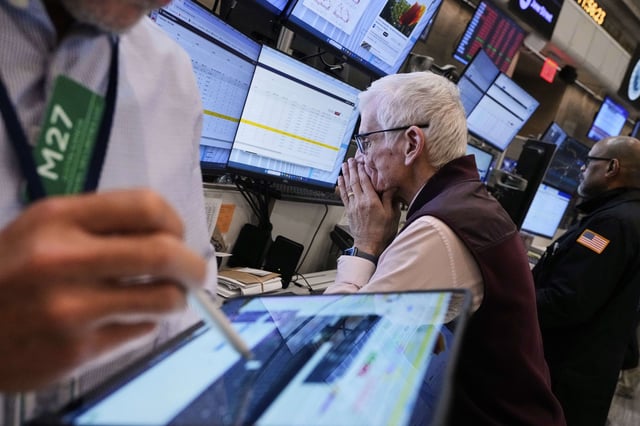 Trader Peter Herits, center, works on the options floor of the New York Stock Exchange, Thursday, April 10, 2025.