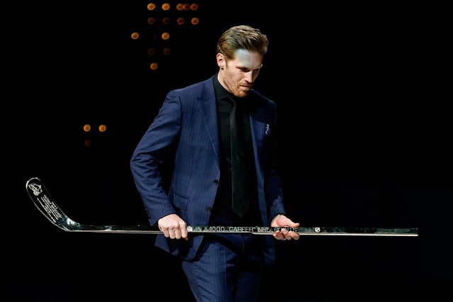 Mar 16, 2025; Denver, Colorado, USA; Colorado Avalanche captain Gabriel Landeskog carries a commemorative stick for center Nathan MacKinnon (not pictured) during an on ice presentation celebrating 1,000 career points before the game against the Dallas Stars at Ball Arena. Mandatory Credit: Isaiah J. Downing-Imagn Images/File Photo