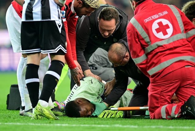 Soccer Football - Serie A - Udinese v AC Milan - Bluenergy Stadium, Udine, Italy - April 11, 2025 AC Milan's Mike Maignan receives medical attention after sustaining an injury REUTERS/Daniele Mascolo