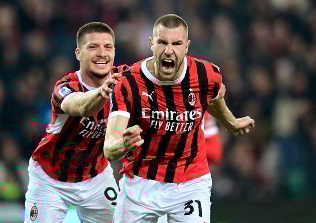 Soccer Football - Serie A - Udinese v AC Milan - Bluenergy Stadium, Udine, Italy - April 11, 2025 AC Milan's Strahinja Pavlovic celebrates scoring their second goal with Luka Jovic  REUTERS/Daniele Mascolo