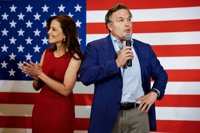 Republican Party U.S. Senate candidate David McCormick speaks to supporters alongside his wife, Dina Powell McCormick, at an election night event in Pittsburgh, Pennsylvania, U.S. May 17, 2022. Picture taken May 17, 2022.Picture taken May 17, 2022.  REUTERS/Quinn Glabicki/File photo