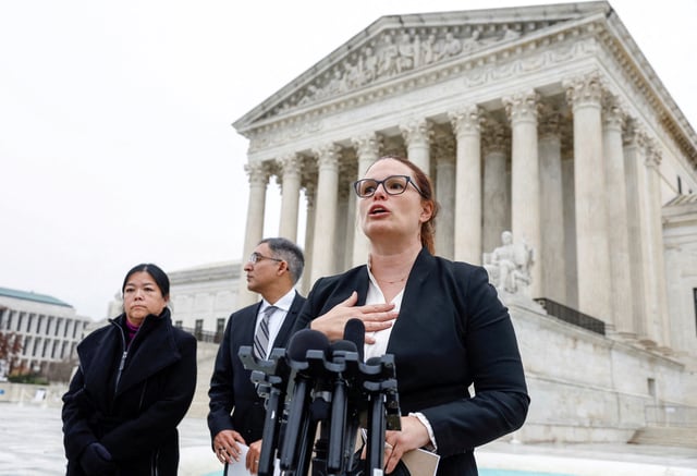 Allison Riggs, chief counsel of voting rights at the Southern Coalition for Social Justice, attorney Neal Katyal and Kathay Feng, national redistricting director at Common Cause, speak to the media outside of the United States Supreme Court following oral arguments in Moore v. Harper, a Republican-backed appeal to curb judicial oversight of elections, in Washington, U.S., December 7, 2022. REUTERS/Evelyn Hockstein/File Photo