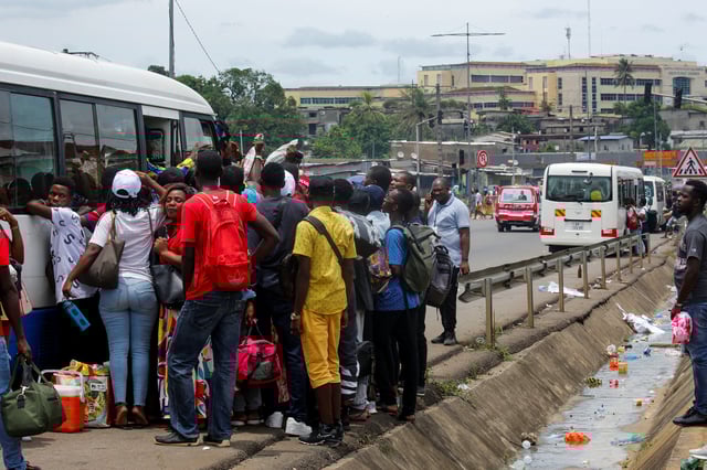 People prepare to take a bus to vote in the towns where they have registered, a day ahead of the 2025 Gabonese presidential election in Libreville, Gabon, April 11, 2025. REUTERS/Luc Gnago