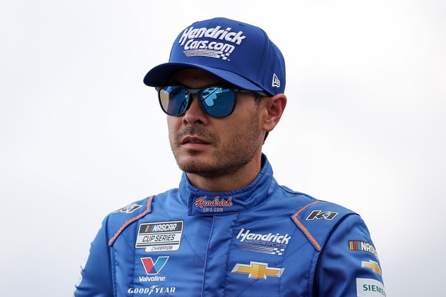 Kyle Larson, driver of the #5 HendrickCars.com Chevrolet, walks the grid prior to the NASCAR Cup Series Goodyear 400 at Darlington Raceway on April 06, 2025 in Darlington, South Carolina. (Photo by /)