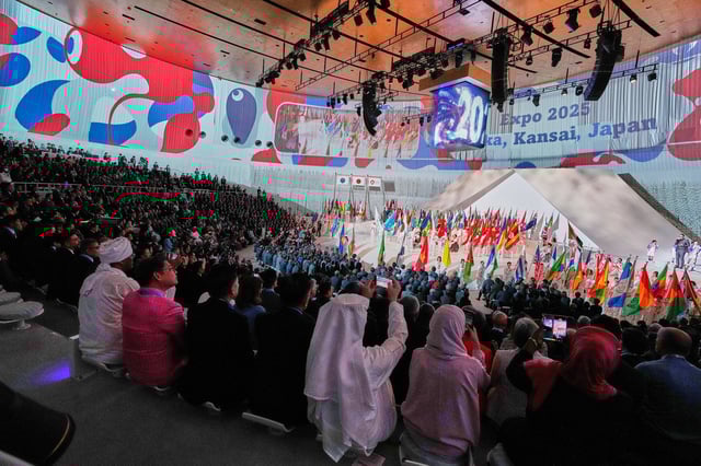 Flag bearers enter the venue during the opening ceremony of Osaka Expo 2025 in Osaka, western Japan, Saturday, April 12, 2025. (AP Photo/Hiro Komae)