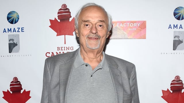 Director Ted Kotcheff arrives at a premiere.