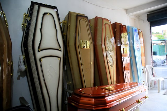 Stock photograph showing an array of coffins taken in February 2021.