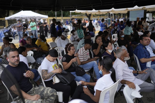 Family members wait to receive the remains of their loved one who died at the Jet Set nightclub days after its roof collapsed, killing more than 200 people, at the National Institute of Forensic Pathology in Santo Domingo, Dominican Republic, Friday, April 11, 2025. (AP Photo/Matias Delacroix)