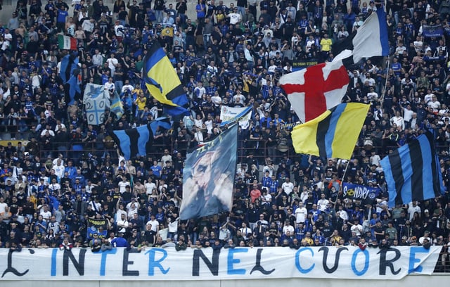 Soccer Football - Serie A - Inter Milan v Cagliari - San Siro, Milan, Italy - April 12, 2025 Inter Milan fans with banners in the stands REUTERS/Alessandro Garofalo