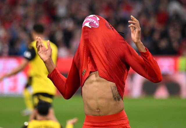 Soccer Football - Bundesliga - Bayern Munich v Borussia Dortmund - Allianz Arena, Munich, Germany - April 12, 2025 Bayern Munich's Michael Olise reacts after missing a chance to score REUTERS/Angelika Warmuth