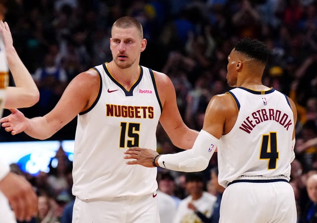 Apr 11, 2025; Denver, Colorado, USA; Denver Nuggets center Nikola Jokic (15) and guard Russell Westbrook (4) celebrate defeating the Memphis Grizzlies at Ball Arena. Mandatory Credit: Ron Chenoy-Imagn Images/File Photo