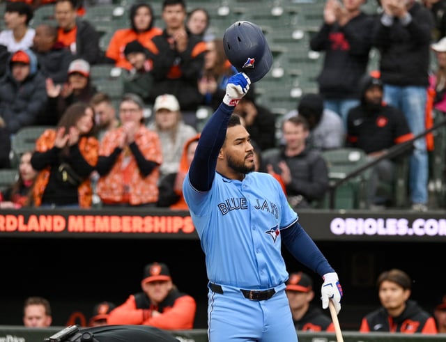 Former Orioles star Anthony Santander tips his helmet to fans before his first at-bat at Camden Yards on Saturday as a member of the Blue Jays. (Kenneth K. Lam/Staff)