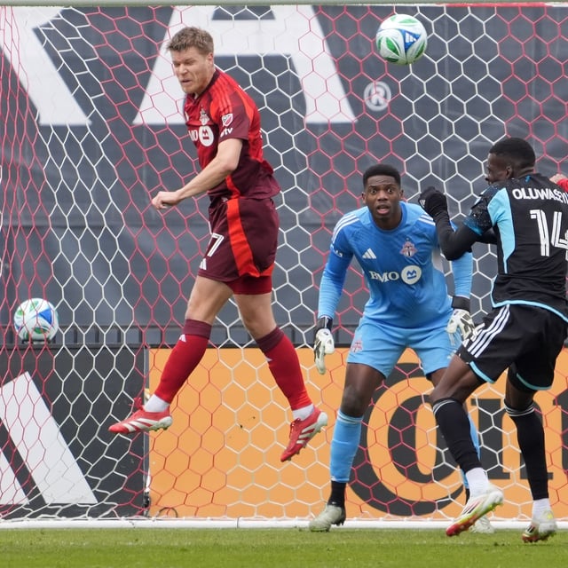Toronto FC defender Sigurd Rosted (17) clears a corner from in front of teammate Sean Johnson (1) during first-half MLS action against Minnesota United in Toronto on Saturday, April 12, 2025. THE CANADIAN PRESS/Frank Gunn
