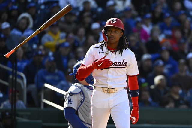 Apr 9, 2025; Washington, District of Columbia, USA; Washington Nationals shortstop CJ Abrams (5) flips his bat after hitting a solo home run against the Los Angeles Dodgers during the first inning at Nationals Park. Mandatory Credit: Brad Mills-Imagn Images/File Photo