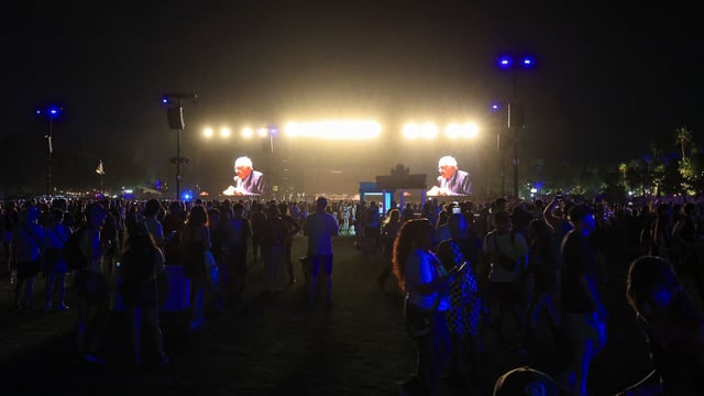 US Senator Bernie Sanders, Independent from Vermont, is seen on giant screens as he speaks on stage during the 2025 Coachella Valley Music and Arts Festival at Empire Polo Club on April 12, 2025 in Indio, California.
