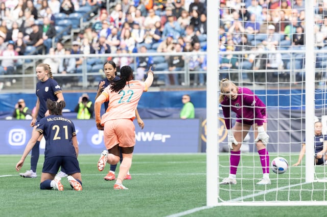 Apr 12, 2025; Seattle, Washington, USA; Orlando Pride forward Barbra Banda (22) celebrates scoring the first goal of the game against the Seattle Reign in the first half at Lumen Field. Mandatory Credit: Melissa Levin-Imagn Images