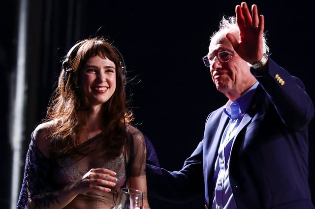 Clairo and Bernie Sanders speak onstage at Outdoor Theatre during the 2025 Coachella Valley Music and Arts Festival at Empire Polo Club on April 12, 2025 in Indio, California.