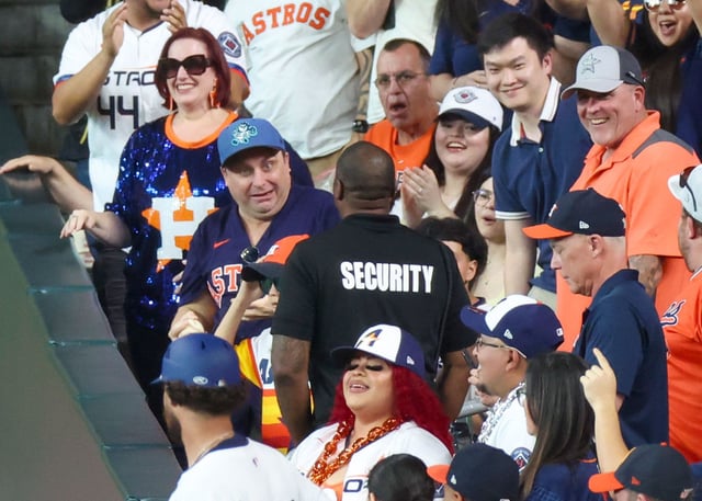 The fan and his son were moved to a different part of the stadium following the catch.
