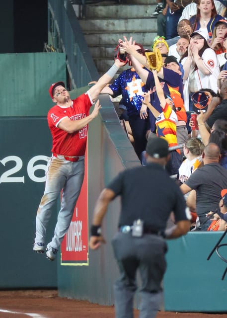 The ball was ruled foul as the catch occurred outside of the field of play.