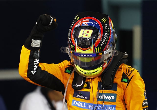 Formula One F1 - Bahrain Grand Prix - Bahrain International Circuit, Sakhir, Bahrain - April 13, 2025 McLaren's Oscar Piastri celebrates after winning the Bahrain Grand Prix REUTERS/Rula Rouhana