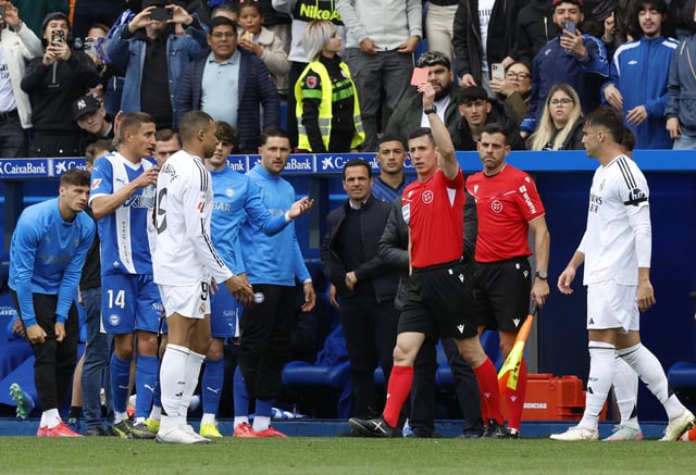 Soccer Football - LaLiga - Deportivo Alaves v Real Madrid - Estadio Mendizorroza, Vitoria-Gasteiz, Spain - April 13, 2025 Real Madrid's Kylian Mbappe is shown a red card by referee Cesar Soto Grado REUTERS/Vincent West