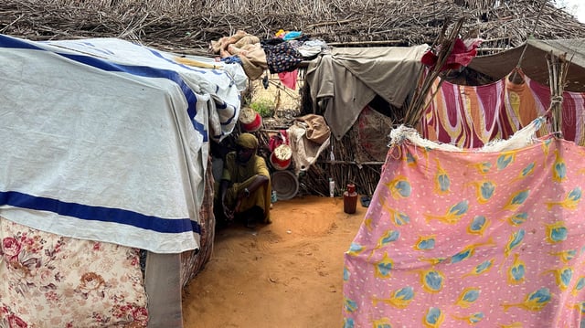 A displaced Sudanese woman rests inside a shelter at Zamzam camp, in North Darfur, Sudan, August 1, 2024. REUTERS/Mohamed Jamal Jebrel/File Photo