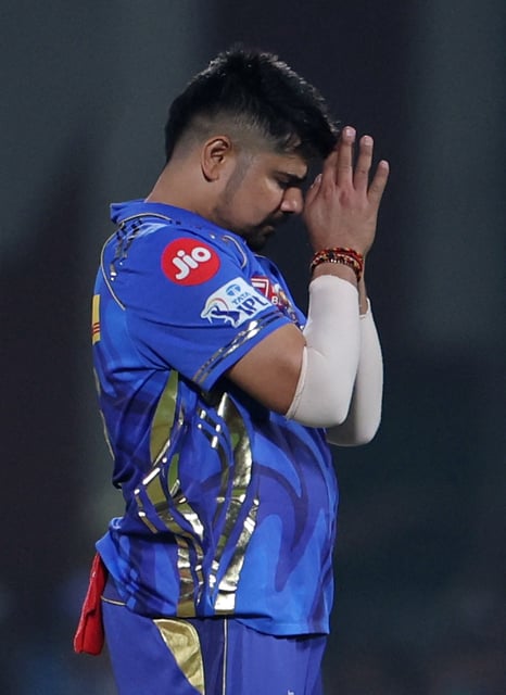 Cricket - Indian Premier League - IPL - Delhi Capitals v Mumbai Indians - Arun Jaitley Stadium, Delhi, India - April 13, 2025 Mumbai Indians' Karn Sharma celebrates after taking the wicket of Delhi Capitals' KL Rahul REUTERS/Anushree Fadnavis