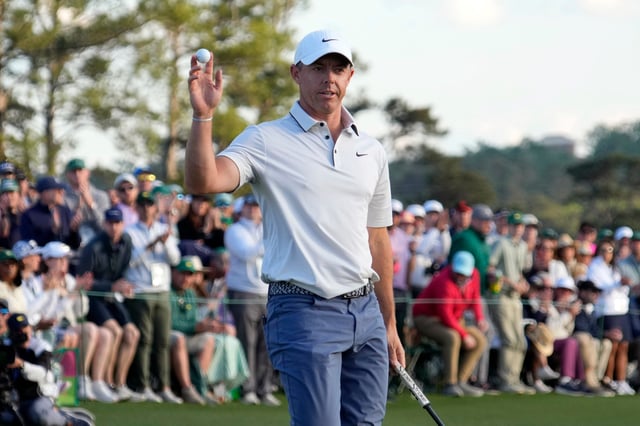 Rory McIlroy reacts after putting on the 18th green during the third round of the Masters Tournament at Augusta National Golf Club.