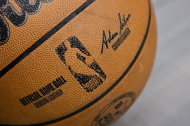 Apr 11, 2025; Dallas, Texas, USA; A view of an NBA basketball and the NBA logo before the game between the Dallas Mavericks and the Toronto Raptors at the American Airlines Center. Mandatory Credit: Jerome Miron-Imagn Images