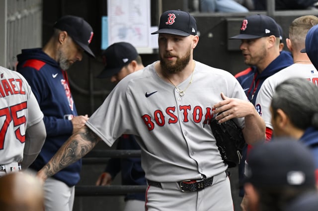 Apr 13, 2025; Chicago, Illinois, USA;  Boston Red Sox pitcher Garrett Crochet (35) high fives teammates after he pitched against the Chicago White Sox during the first inning at Guaranteed Rate Field. Mandatory Credit: Matt Marton-Imagn Images