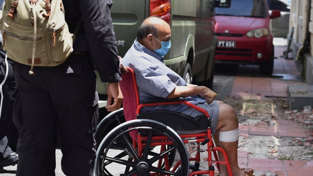 File photo of Mehul Choksi being taken in a wheelchair to the magistrate's court by police after his arrest for illegal entry into Dominica, in Roseau on June 4, 2021.