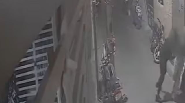 The disturbing act was captured by a surveillance camera mounted outside a nearby house in Bengaluru.