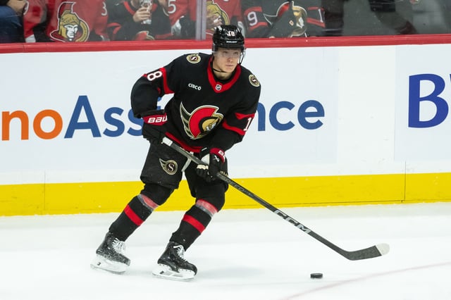 Apr 13, 2025; Ottawa, Ontario, CAN; Ottawa Senators center Tim Stutzle (18) controls the puck in overtime against the Philadelphia Flyers at the Canadian Tire Centre. Mandatory Credit: Marc DesRosiers-Imagn Images