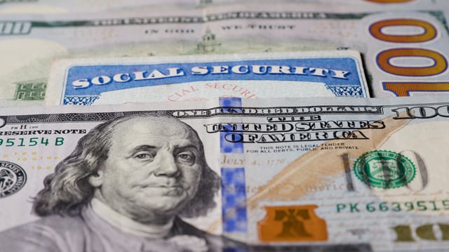 Stock image/file photo: A Social Security card with U.S. Dollars.