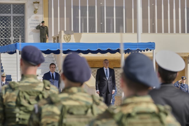 Greek Defense Minister Nikos Dendias, right, and his French counterpart Sebastien Lecornu, left, inspect the guard of honour before their meeting in Athens, Greece, Monday, April 14, 2025. (AP Photo/Petros Giannakouris)