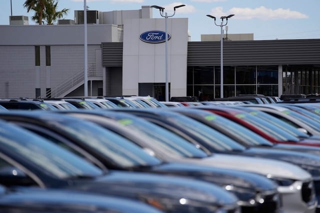 SUVs sit on display at a Ford dealership Friday, April 4, 2025, in Las Vegas. (AP Photo/John Locher)