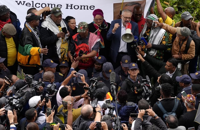 Expelled South Africa Ambassador Ebrahim Rasool speaks to supporters upon his arrival at Cape Town International Airport, in Cape Town, South Africa, Sunday, March 23, 2025. (AP Photo/Nardus Engelbrecht)