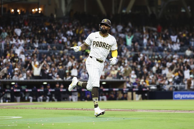 San Diego Padres' Jason Heyward points towards his dugout while running the bases after hitting a solo home run against the Colorado Rockies in the first inning of a baseball game Saturday, April 12, 2025, in San Diego. (AP Photo/Derrick Tuskan)