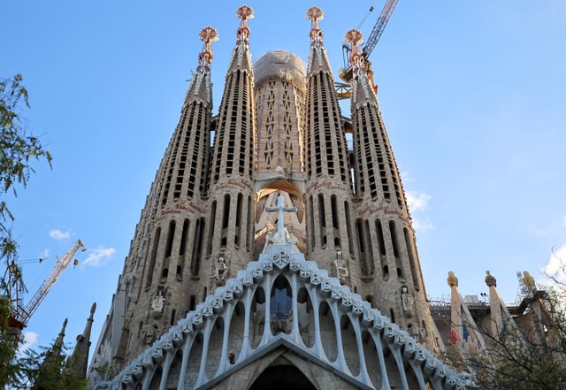 A worker works on the Passion Facade of the Sagrada Familia Basilica, in Barcelona, Spain October 4, 2024. REUTERS/Nacho Doce/File Photo