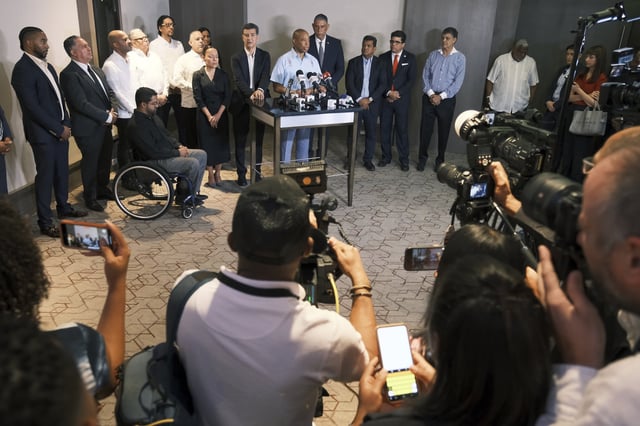 New York Mayor Eric Adams, accompanied by Dominican authorities, speaks to the press in Santo Domingo, Dominican Republic, Monday, April 14, 2025, upon arrival to pay his respects to those who died at the Jet Set nightclub after its roof collapsed. (AP Photo/Ricardo Hernandez)
