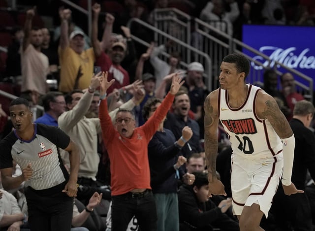 The fans celebrate as Houston Rockets forward Jabari Smith Jr. (10) scores a three point basket against the Philadelphia 76ers during overtime of a NBA game at Toyota Center in Houston, Monday, March 17, 2025.