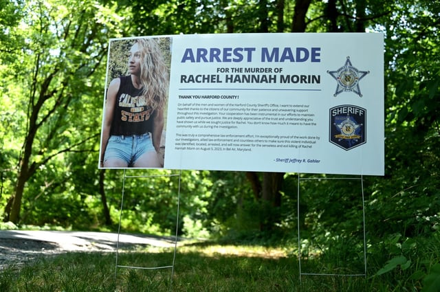 Harford County Sheriff’s Office deputies posted signs at each Ma &amp; Pa Trail head announcing the arrest in the Rachel Morin homicide investigation. (Lloyd Fox/Staff)